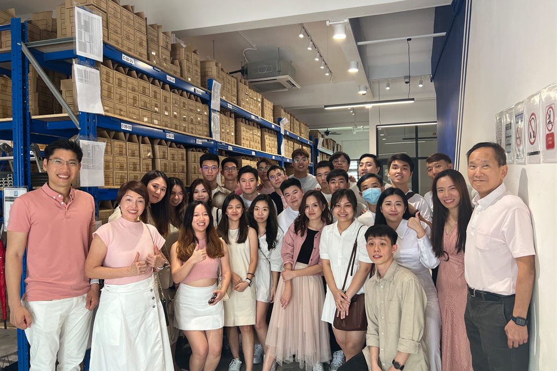 The RFS Hydraulics team in the Johor Bahru warehouse, in front of racked stock