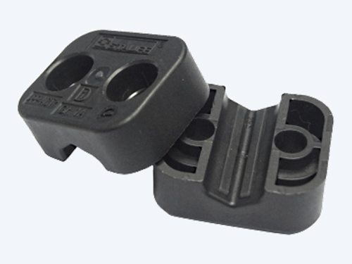 STAUFF ACT twin series clamp halves open, showing two bores each with elastomer strips