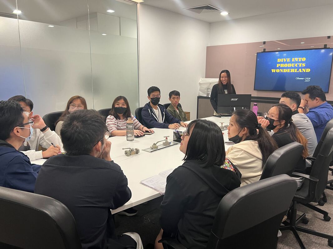 A product training session, with valve samples on the meeting room table