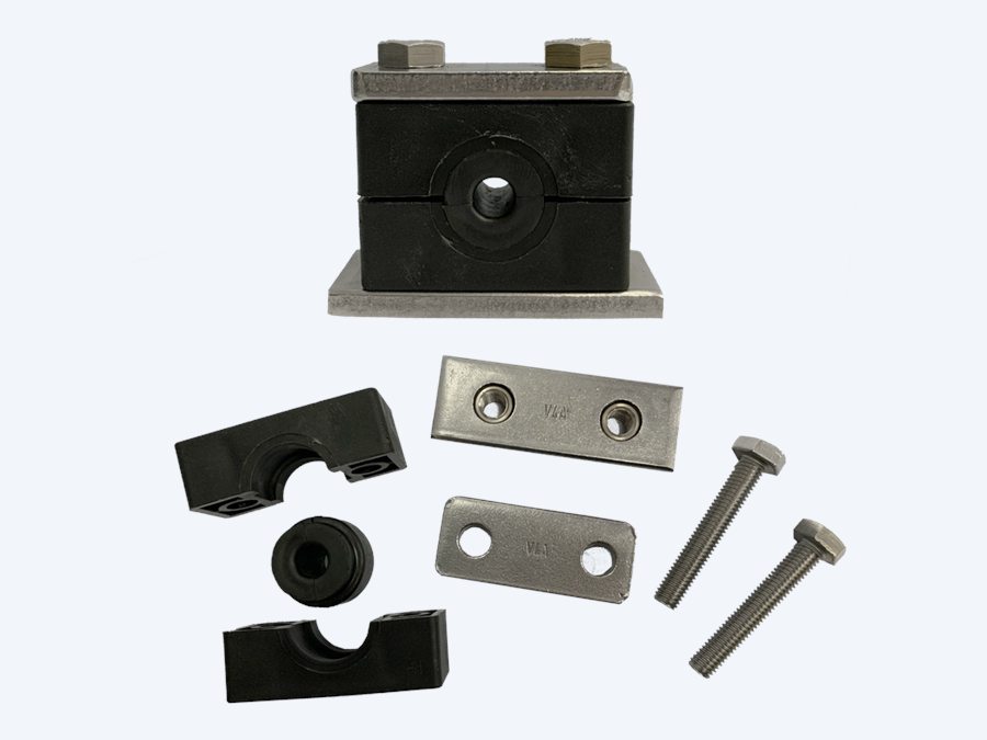 Tubeclo rubber insert clamp complete set laid out: two polyamide shell halves, the elastomer insert, top plate, base weld plate and two stainless hexagon bolts